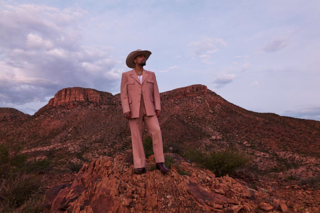 A photo of Devon Gilfillian wearing a cowboy hat